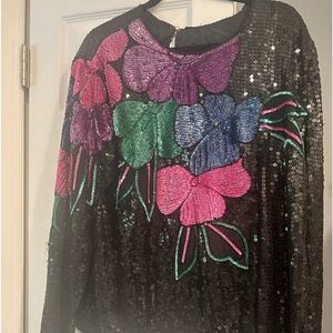 Beautiful new with tags sequin top with butterflies on the front and black back
